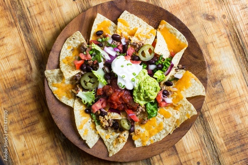 Fényképezés Nacho Cheese Tortilla chips with chili and salsa