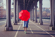 © Song_about_summer - fashion woman with red umbrella walking on the street in Paris