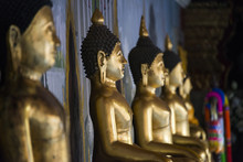 Close Up Of Golden Buddha Statues In Temple