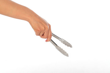 hand use tongs on white background, selective focus