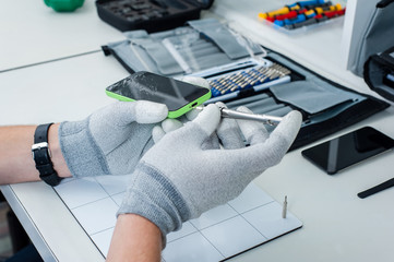 Wall Mural - Close-up photos showing process of mobile phone repair