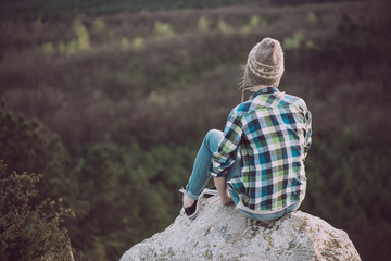 Wall Mural - Young woman watching landscape, posing outdoor. Active lifestyle concept. 