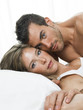 © Studio Trebuchet - attractive couple in love under white bed sheets