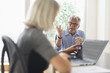© JGI/Tom Grill/Blend Images - Older Caucasian business people arguing in office meeting