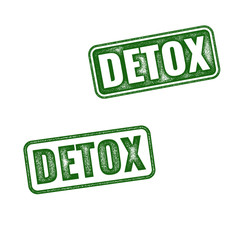 Two variants of green Detox rubber stamp isolated on white background