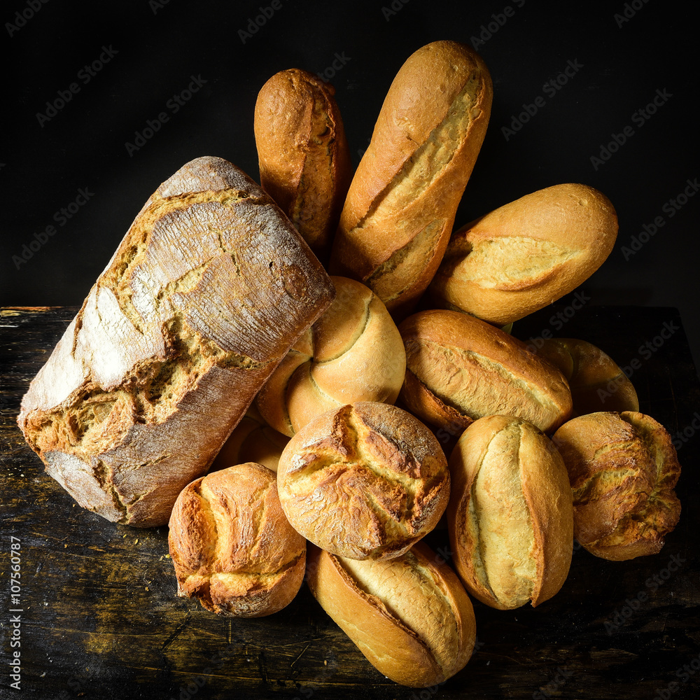 Different types of bread and rolls - obrazy, fototapety, plakaty 