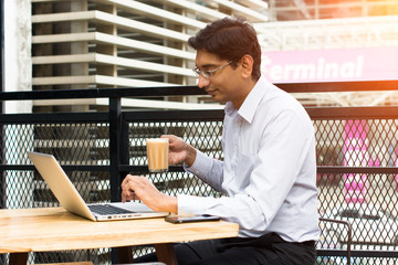 Wall Mural - indian business male having milk tea