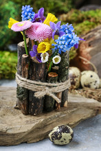 Spring Table Decoration With Sticks And Fresh Flowers