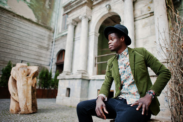 Fashion portrait of black african american man on green velvet j