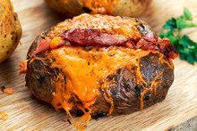 Hot Baked Potato With Cheese, Bacon And Sour Cream