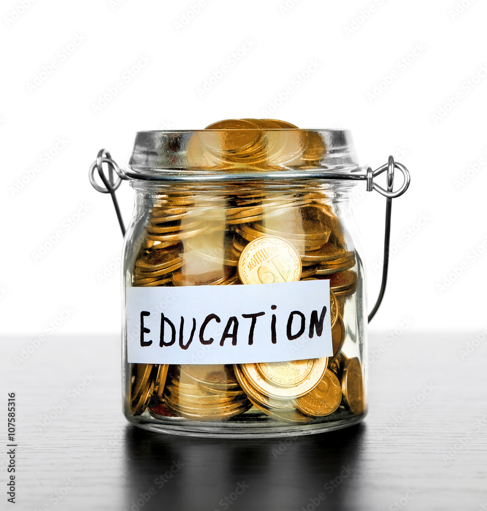 Jar for savings full of coins