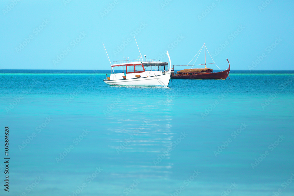 Boats in blue ocean.