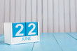 June 22nd. Image of june 22 wooden color calendar on white background. Summer day. Empty space for text