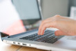 © jannoon028 - Closeup of business woman hand typing on laptop keyboard