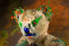 Colorful Teddy Bear With Paint On It
