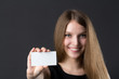 © stas_80 - young beautiful girl holding a business card in hand