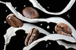 Coffee beans with milk splash isolated on black