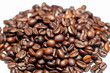 pile of coffee beans of white background. selective focus. small depth of focus.