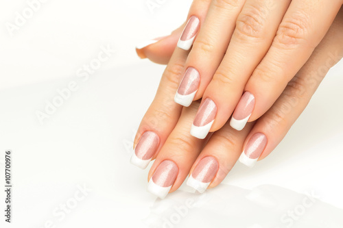 Woman hands with french manicure  close-up Fototapet