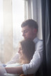© ribalka yuli - Young couple enjoying themselves on the windowsill