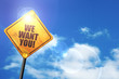 Yellow road sign with a blue sky and white clouds: we want you!
