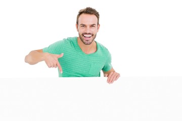 Poster - Happy young man showing white board