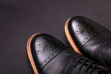 black oxford shoes with shoelace top view closeup