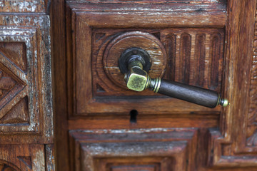 Wall Mural - Vintage bronze door knob on handmade wood carving door