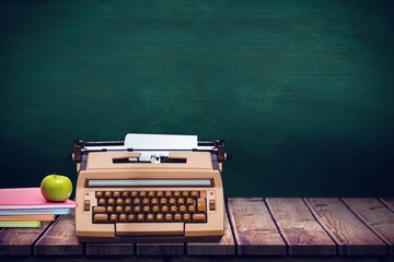 Poster - Composite image of green apple on notebooks