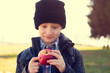 © sakkmesterke - Little hipster boy with red apple