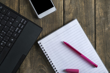 Wall Mural - Blank notepad, phone and  laptop  on office wooden table