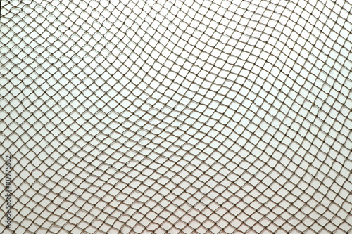 Fotomural Close up of fish net against white background