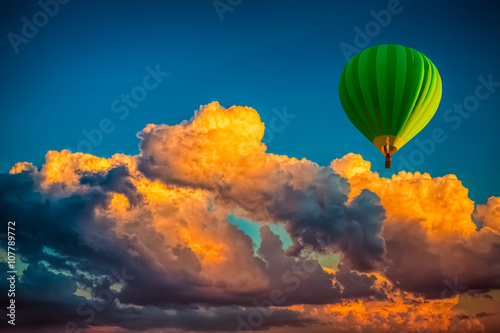 hot-air-balloon-with-cloudy-sunrise-background