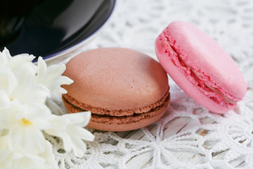 Wall Mural - Cup of green tea, color macaroon and white flowers