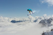 © Vasily Merkushev - Flying snowboarder on mountains. Extreme sport.