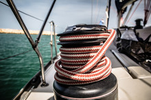 Winch With Red And White Rope On Sailing Boat In The Sea