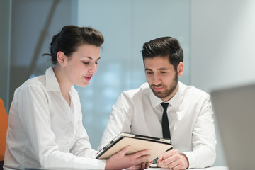 Wall Mural - young business couple working together on project