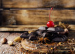 © wilddrago - pieces of chocolate with nuts and cinnamon