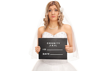 Canvas Print - Sad young bride posing for a mug shot