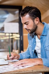 Aufkleber - Man in office writing in a notepad