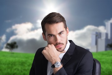 Poster - Composite image of cheerful businessman posing with hand on chin