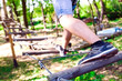 © davit85 - adventure climbing high wire park - people on course in mountain