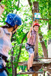 © davit85 - adventure climbing high wire park - people on course in mountain