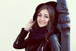 © Angelika Smile - portrait of a smiling girl leaning on a pillar