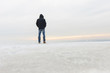 © Leonart's - Back view of man standing on snow and watching nature