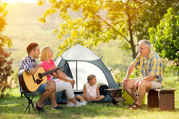 Wall Mural - happy family camping at countryside.