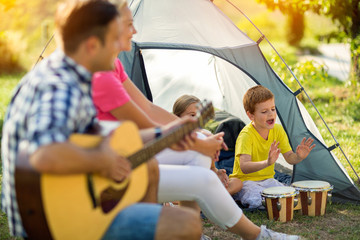 Wall Mural - children enjoying on camping in the tent.