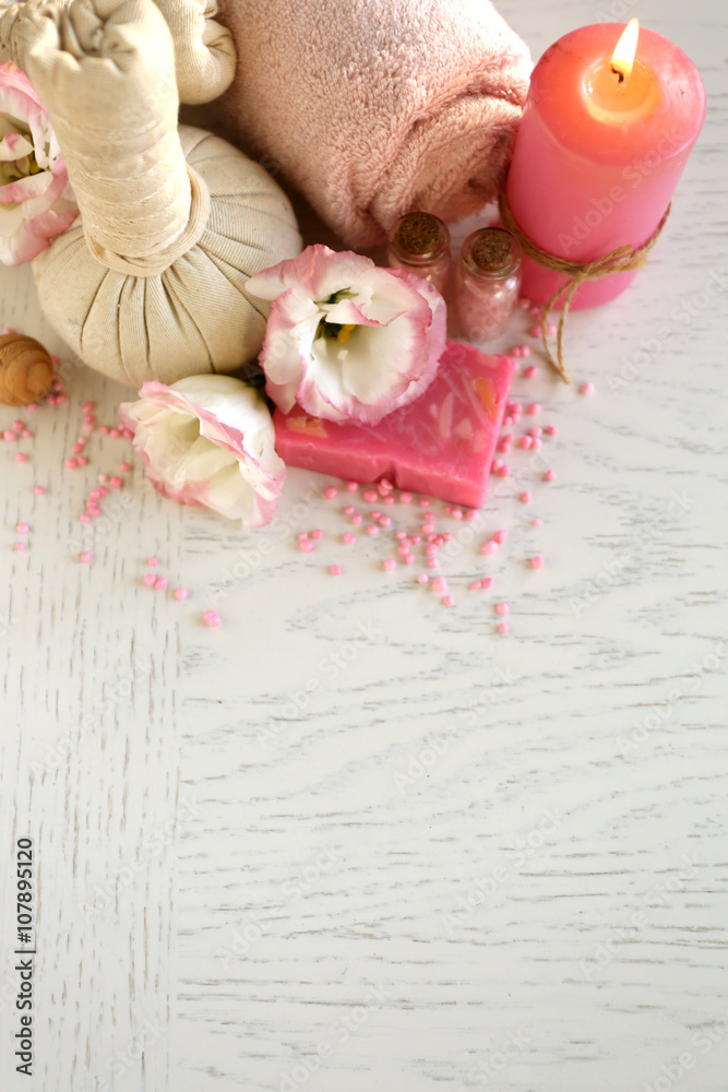 Beautiful composition of spa treatment on a white wooden table