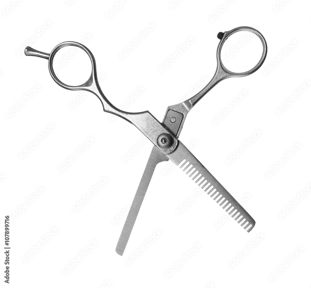 Professional metal scissors in open position isolated on white