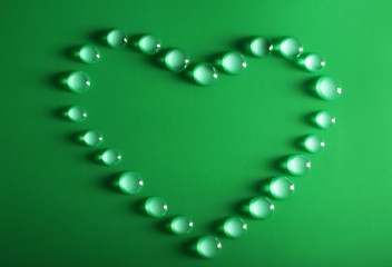 Poster - Water drops on a green surface, top view